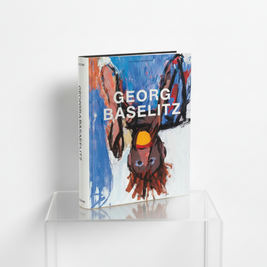 A hardcover art book titled 'Georg Baselitz' by Naxos, featuring a colorful abstract cover illustration and shown at an angle on a solid orange background.